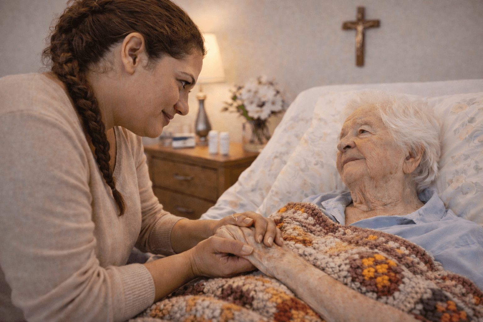 Caregiver providing compassionate end-of-life care and comfort support to an elderly woman at home.